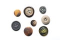 Collection of eight sewing buttons on white background Royalty Free Stock Photo