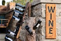 A collection of empty Georgian wine bottles on a a wooden rack. Wine tasting concept image