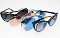 Collection of fashionable sunglasses on white