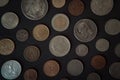 Collection of foreign coins on a black background