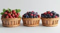 A collection of fresh berries in wooden baskets for summer desserts Royalty Free Stock Photo