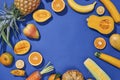 Collection of fresh yellow fruit and vegetables on the blue background Royalty Free Stock Photo