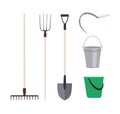 Collection of garden tools or agricultural implements isolated on white background - rake, pitchfork shovel, buckets