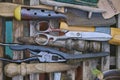 Collection of garden utensils on a bench vertical view