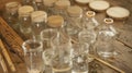 A collection of glass jars filled with varying levels of water acting as a homemade set of tuneful instruments. Each jar