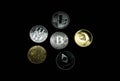 A collection of gold and silver cryptocurrency coins