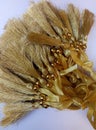 A collection of gold tassel pendants with round beads