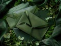 A collection of green envelopes arranged on a vibrant green fabric Royalty Free Stock Photo