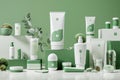 Elegant Skincare Product Collection Displayed with Natural Elements on a Green Background Royalty Free Stock Photo
