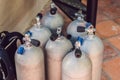 Collection of grey scuba diving air oxygen tanks waiting Royalty Free Stock Photo