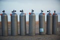 Collection of grey scuba diving air oxygen tanks. Royalty Free Stock Photo