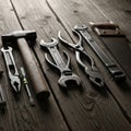 A collection of hand tools is arranged on a rustic wooden surface Royalty Free Stock Photo