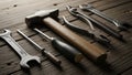 A collection of hand tools is arranged on a rustic wooden surface Royalty Free Stock Photo