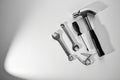 Collection of hand tools on white surface, overhead view, hammer, wrenches, screwdriver, clamp Royalty Free Stock Photo