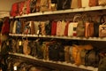 Collection of handbags on display at shopping center.