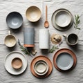 Ceramic tableware is arranged on a textured light gray fabric Royalty Free Stock Photo