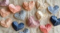 Collection of Handmade Paper Hearts on Textured Fabric Royalty Free Stock Photo