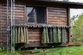 Collection of hip waders hanging up drying outside on a rustic wood cabin Royalty Free Stock Photo