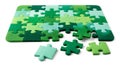 Many green puzzle pieces assembled and scattered showing interlocking parts Royalty Free Stock Photo