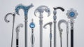 Collection of Ornate Silver Walking Canes with Gemstone Embellishments on White Background Royalty Free Stock Photo