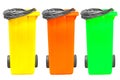 Collection of large colorful trash cans (garbage bins) isolated on white