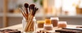 The collection of makeup brushes in a stylish jar with palettes and jars. AI generated image Royalty Free Stock Photo