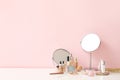 Set of decorative cosmetics and mirrors on dressing table Royalty Free Stock Photo