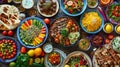 A collection of many different types of food spread out on a wooden table. The dishes are diverse and look appetizing Royalty Free Stock Photo