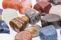 Collection of many kinds of polished gemstones originating from all of the continents isolated Royalty Free Stock Photo