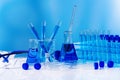 Collection of medical flasks on a blue background.Science glass flask blue chemistry laboratory banner background Royalty Free Stock Photo