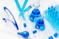 Collection of medical flasks on a blue background.Science glass flask blue chemistry laboratory banner background Royalty Free Stock Photo