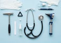A collection of medical tools is arranged on a light blue background Royalty Free Stock Photo