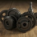 A collection of metallic gears is displayed on a wooden surface. The gears vary in size Royalty Free Stock Photo