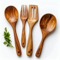 Artisan crafted wooden kitchen utensil set with herb accent, culinary elegance on white background Royalty Free Stock Photo