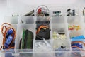 Collection of microcontroller parts in a box, Micro servo, LCD display and other electronic components for building stem projects