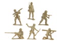 Collection of miniature toy soldiers with guns on white background. Royalty Free Stock Photo