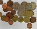 collection of mixed euro coins scattered on a white surface. The image shows various denominations in different metallic Royalty Free Stock Photo