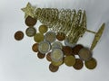 collection of mixed euro coins scattered on a white surface. The image shows various denominations in different metallic Royalty Free Stock Photo
