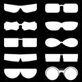 Set of silhouettes of glasses of different shapes. Vector illustration on a black background.