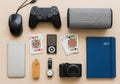 Collection of modern electronic gadgets and personal items arranged neatly on a light colored surface Royalty Free Stock Photo