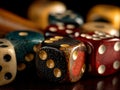 A collection of multicolored dice on a dark surface, captured mid-roll, symbolizing chance or decision-making in the Royalty Free Stock Photo