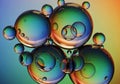 A collection of multicolored spheres floating against a smooth Royalty Free Stock Photo
