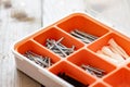 Collection of nails, screws and bolts in plastic box