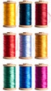 Collection of Nine Vibrant Metallic Thread Spools on White Background Royalty Free Stock Photo