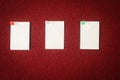 Collection of note papers pinned on a red board ready for filling in quotes. Royalty Free Stock Photo