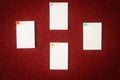 Collection of note papers pinned on a red board ready for filling in quotes. Royalty Free Stock Photo