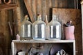 Still life with glass jugs in an old shed. Royalty Free Stock Photo