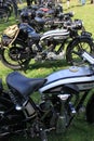 Collection of old motorcycles in England in the summer.