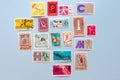 Collection of old postal stamps flat lay. International sport topic mail stamps