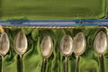 Collection of old silver spoons in velvet box Royalty Free Stock Photo